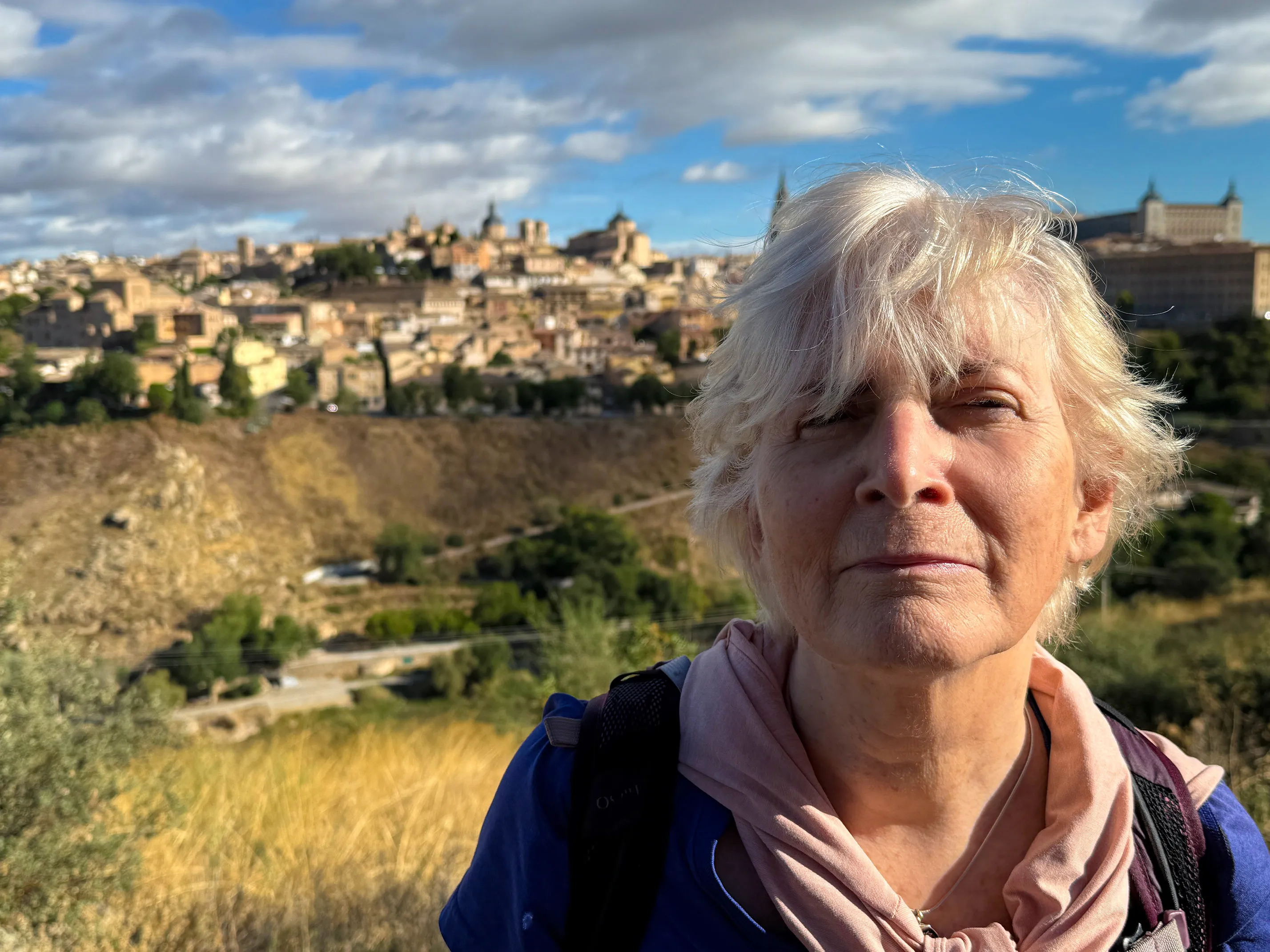 self-portrait with a village in the background